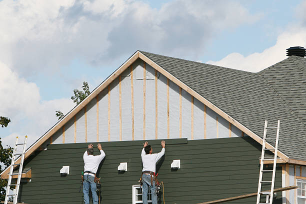 Professional Siding Contractor technician working in Winburne, PA